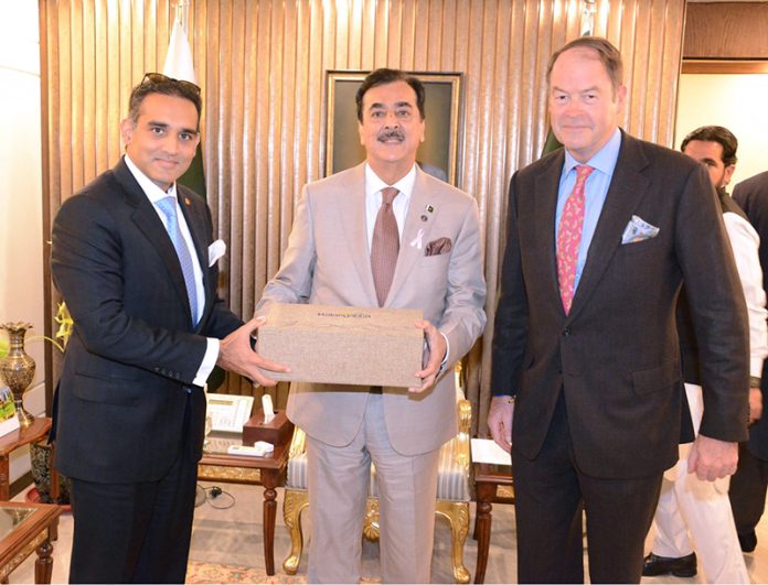 Chairman Senate Syed Yousaf Raza Gilani presenting souvenir to Lord Amir Sarfraz of Kensington (Member of the House of Lords) and General Patrick Sander at Parliament House