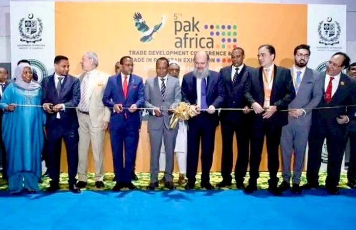 Federal Minister for Commerce, H.E. Jam Kamal Khan, along with Chief Guest H.E. Dr. Alemu Sime Feyisa, Minister of Transport and Logistics of Ethiopia, cuts the ribbon to inaugurate the 5th Pakistan–Africa Trade Development Conference and “Made in Pakistan” Exhibition at Millennium Hall, Addis Ababa