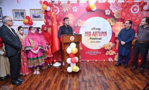 Provincial Secretary for Culture and Tourism, Dr. Abdul Samad and China Window Administrator Amjad Aziz Malik along with other officials and students cutting ribbon during the inauguration ceremony of Mid-Autumn Festival celebration organized by China Window.