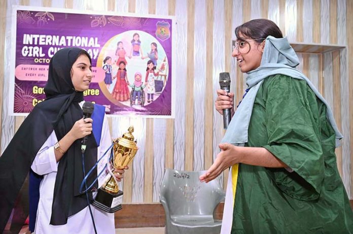 Students performing in a tableau during a function in connection with International Girl Child Day at Government Girls Degree College