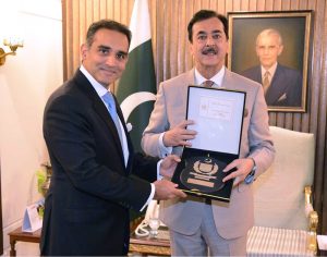 Chairman Senate Syed Yousaf Raza Gilani presenting souvenir to Lord Amir Sarfraz of Kensington (Member of the House of Lords) and General Patrick Sander at Parliament House