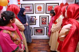 A visitor taking interest in on display books of china during the Mid-Autumn Festival celebration organized by China Window.
