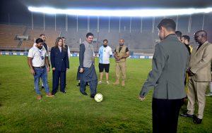 Governor Khyber Pakhtunkhwa, Faisal Karim Kundi, kicking a football to inaugurate the Dream Fest 2025 event at Jinnah Stadium, Sports Complex