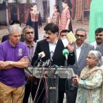 Sindh Chief Minister Syed Murad Ali Shah displays the polio vaccination certificate of a newborn baby after administering polio drops at KMC Maternity Home, Gizri, during a media talk following the inauguration of the week-long province-wide anti-polio campaign