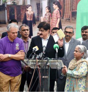 Sindh Chief Minister Syed Murad Ali Shah displays the polio vaccination certificate of a newborn baby after administering polio drops at KMC Maternity Home, Gizri, during a media talk following the inauguration of the week-long province-wide anti-polio campaign