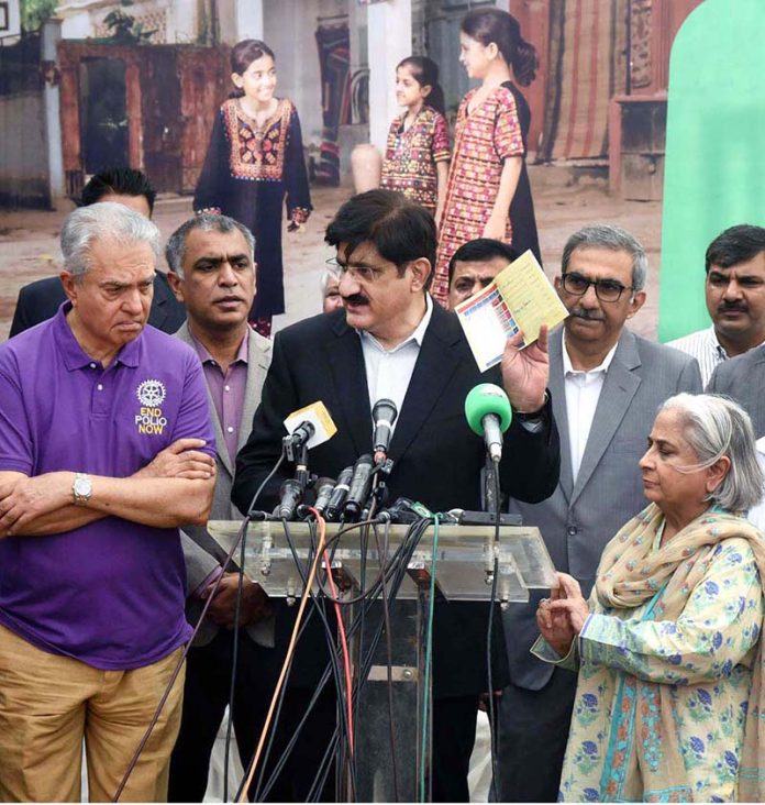 Sindh Chief Minister Syed Murad Ali Shah displays the polio vaccination certificate of a newborn baby after administering polio drops at KMC Maternity Home, Gizri, during a media talk following the inauguration of the week-long province-wide anti-polio campaign