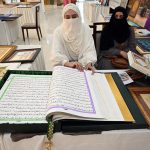 Women displaying Islamic calligraphy artwork during the 3rd Pakistan Hajj & Umrah Exhibition 2025 at Pak-China Friendship Centre