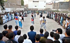 Youngsters playing Volleyball game near PCB Cricket Ground Shaikh Zaid Colony.