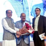 President Arts Council of Pakistan, Muhammad Ahmed Shad along with Chairman of Pakistan People’s Party (PPP) Bilawal Bhutto Zardari presenting a bouquet of flower to PPP leader Mian Raza Rabbani at the Dedication Ceremony of Book titled 'The Smile Snatchers' by PPP leader Main Raza Rabbani at Arts Council of Pakistan