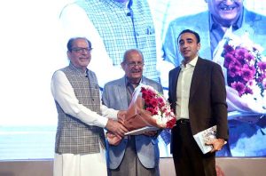 President Arts Council of Pakistan, Muhammad Ahmed Shad along with Chairman of Pakistan People’s Party (PPP) Bilawal Bhutto Zardari presenting a bouquet of flower to PPP leader Mian Raza Rabbani at the Dedication Ceremony of Book titled 'The Smile Snatchers' by PPP leader Main Raza Rabbani at Arts Council of Pakistan