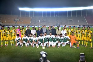 Governor Khyber Pakhtunkhwa, Faisal Karim Kundi, kicking a football to inaugurate the Dream Fest 2025 event at Jinnah Stadium, Sports Complex
