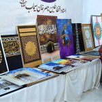 Visitor viewing Islamic calligraphy artwork during the 3rd Pakistan Hajj & Umrah Exhibition 2025 at Pak-China Friendship Centre