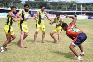 Kabaddi players in action during the match between Khyber Pakhtunkhwa and Sindh teams at Punjab Stadium.