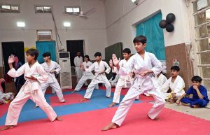 Marshal art young student demonstrate her skills during the Karate Academy Belt Promotion ceremony at the University of Sargodha.