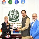 Muhammad Raza Hayat Harraj, Federal Minister for Defence Production presenting a souvenir to H.E. Ms. Ina Lepel, Ambassador of Federal Republic of Germany