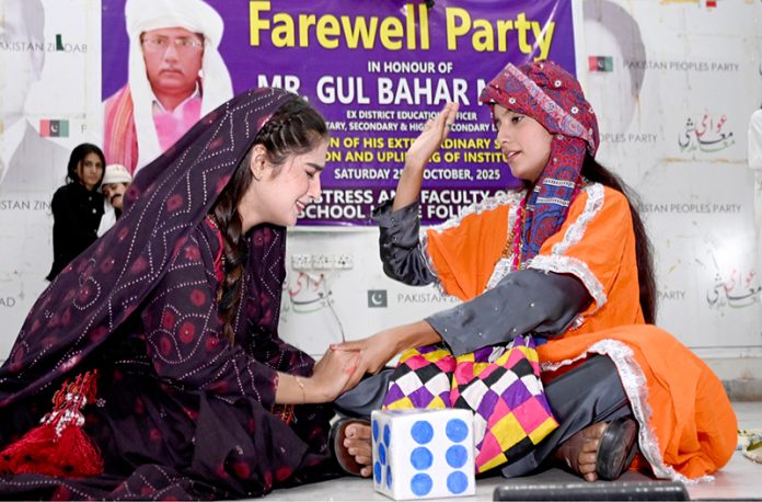 Students of Govt Girls Little Folks Higher Secondary School performing in a tableau during Farewell Party in Honour Ex-District Education Officer (ES&HS) Gul Bahar Magsi at Begum Nusrat Bhutto Hall Jinnah Bagh