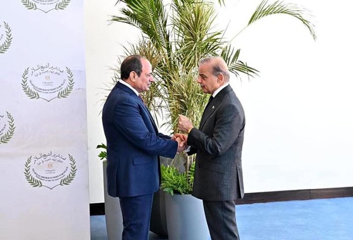 Egyptian President Abdel Fattah El-Sisi receiving Prime Minister Muhammad Shehbaz Sharif upon his arrival to attend Sharm El Sheikh Peace Summit