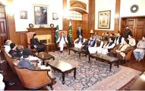 Acting President Syed Yousuf Raza Gilani in a meeting with former PPPP MNAs and MPAs at the Governor House.