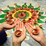Girls from the Hindu community lighting lamps during the Diwali festival at Durga Shiv Mandir in GOR Colony.