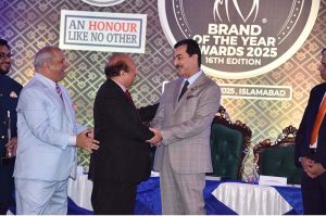 Chairman Senate, Syed Yousaf Raza Gilani shaking hands with Lord Qurban Hussain, Member of the house of Lords at the award distribution ceremony 16th edition of "Brand of the year awards 2025"