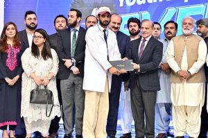 Prime Minister Muhammad Shehbaz Sharif awards laptops to high achieving students at the launching ceremony of Prime Minister's Youth Laptop Scheme 2025.