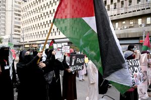 Women activists of Pakistan Palestine Forum chant slogans at a rally outside Karachi Press Club to protest against Israeli genocide in Gaza.