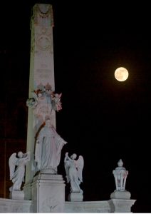 The Supper Moon rises from behind the St. Patrick’s Cathedral.