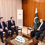 President Asif Ali Zardari talking to Mr Radosław Sikorski, Deputy Prime Minister and Minister of Foreign Affairs of Poland, at Aiwan-e-Sadr