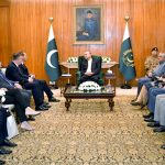 President Asif Ali Zardari talking to Mr Radosław Sikorski, Deputy Prime Minister and Minister of Foreign Affairs of Poland, at Aiwan-e-Sadr