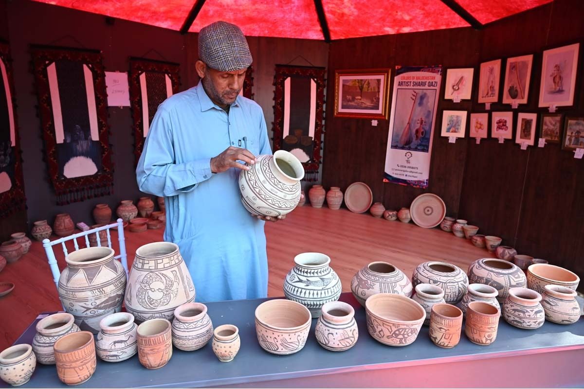 Artisan displaying his hand-made decorative stuff at a stall during the three-day Balochistan Grand Tourism Festival at Lok Virsa in the Federal Capital.