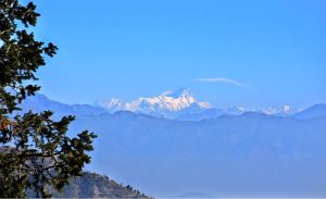A breathtaking panorama from Nathiagali, where the rolling Murree Hills lead the eye toward the distant Kashmir Mountain range rising in the far background