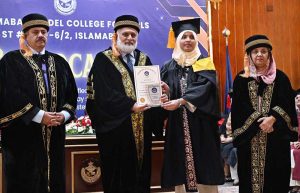 Vice Chancellor Quaid e Azam University, Prof. Dr. Niaz Ahmad Akhtar confers Gold Medal to a graduate at the 7th convocation 2025 Islamabad Model. College for Girls F-6/2
