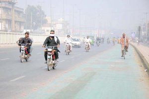 A view of the city engulfed in thick smog, which has reduced visibility and disrupted daily life.