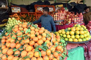 A vendor selling fruits in weekly bazar at Peshawar morr in the Federal Capital