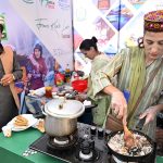 Entrepreneurs selling traditional food at a stall at Ten-Day annual folk festival “Lok Mela 2025” at Lok Virsa