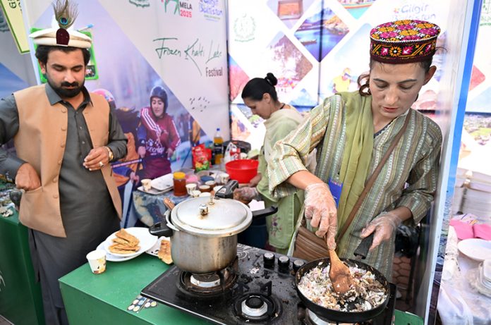 Entrepreneurs selling traditional food at a stall at Ten-Day annual folk festival “Lok Mela 2025” at Lok Virsa