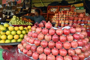 A vendor selling fruits in weekly bazar at Peshawar morr in the Federal Capital