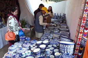 A vendor preparing tradition sajji to attract customers during the ten-day annual folk festival “Lok Mela 2025” at Lok Virsa.