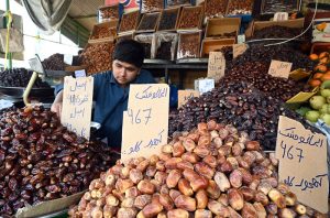 A vendor selling fruits in weekly bazar at Peshawar morr in the Federal Capital