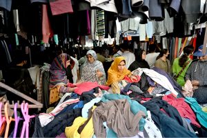 A vendor displaying fish to attract the customers at H-9 Weekly Bazaar in Federal Capital.