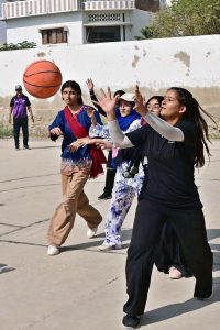 A view of basketball match between Shah Latif Girls College and ISRA Foundation School teams during 5th Hyderabad Olympic Games at Board Stadium.