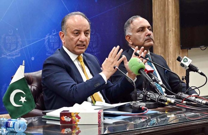 Federal Minister for Climate Change and Environmental Coordination, Senator Musadik Masood Malik and Chairman National Disaster Management Authority (NDMA) Lieutenant General Inam Haider Malik addressing a press conferences at PID Media Center