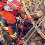 Rescue 1122 personnel remove debris from nearby houses that collapsed after a gas-boiler explosion in a chemical factory near Chak No. 203-RB Malik Pur, which caused multiple deaths and left several others injured