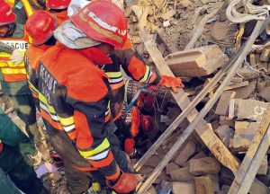 Rescue 1122 personnel remove debris from nearby houses that collapsed after a gas-boiler explosion in a chemical factory near Chak No. 203-RB Malik Pur, which caused multiple deaths and left several others injured