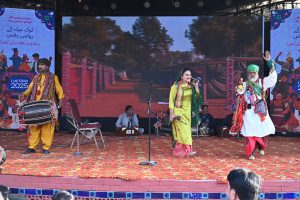Folk artists performing on stage during the Ten-Day annual folk festival “Lok Mela 2025” at Lok Virsa