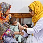 A lady doctor administers a vaccine to a child at Shah Bhitai Hospital during the National Measles and Rubella Prevention Campaign underway in the city