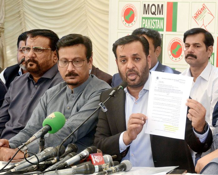 Federal Minister for National Health Services, Regulations and Coordination, Syed Mustafa Kamal, along with MQM-Pakistan MNAs, addresses a press conference at Bahadurabad
