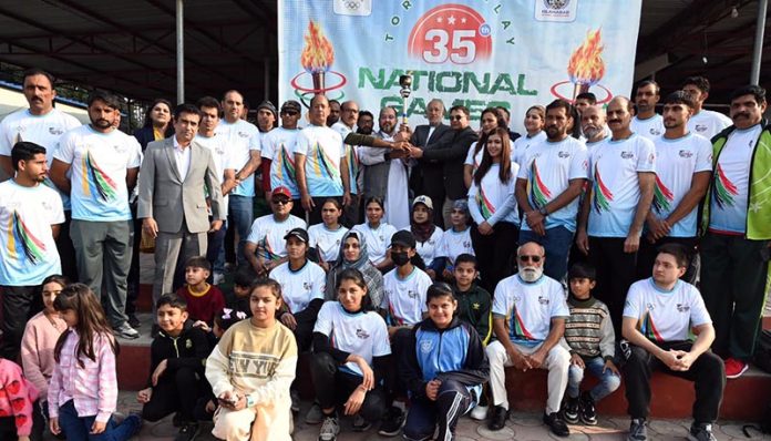 Participants pose for a group photo during the 35th National Games Torch Relay ceremony at Rawal Lake, Islamabad, organized by the Islamabad Olympic Association