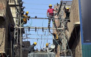 WAPDA workers are installing a new transformer on the electricity supply line to ensure uninterrupted power supply to local residents.