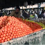 A vendor selling fresh vegatables at weekly Sunday bazar Aabpara in the Federal Capital